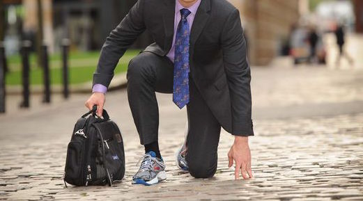 suit and white trainers